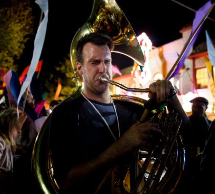 Tuba player Steven Duffy, center, and fellow members of the Raya Brass Band perform at the conclusion of the festival parade in front of the Buskirk-Chumley Theater during Lotus World Music and Arts Festival on Saturday, Sept. 30, 2017.